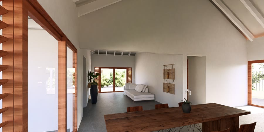 Living area with sofa and console, doors to the terrace