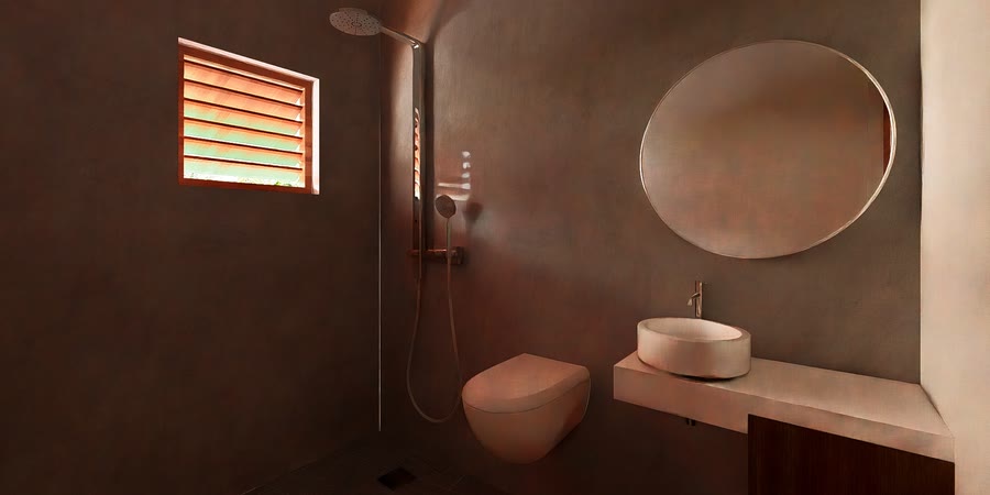Bathroom finished in terracotta plaster with round mirror