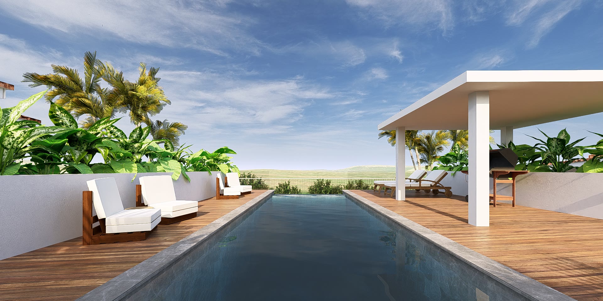 The shared pool at Cas Abou Resort, seen along its length toward the pavilion